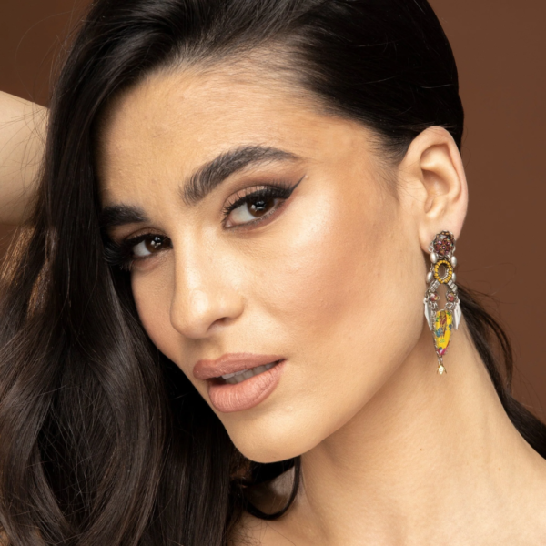 Elegant Ayala Bar Poros Yellow Post Earrings, featuring vibrant yellow tones and intricate beadwork, perfect for adding a touch of bold color and artistic charm to any outfit.