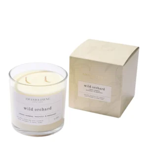 AMANDA + JAYNE Wild Orchard Glass Collection, featuring a vibrant blend of fresh fruits and floral notes. This elegant glass jar adds a luxurious touch to your home while filling the room with a long-lasting, refreshing fragrance.