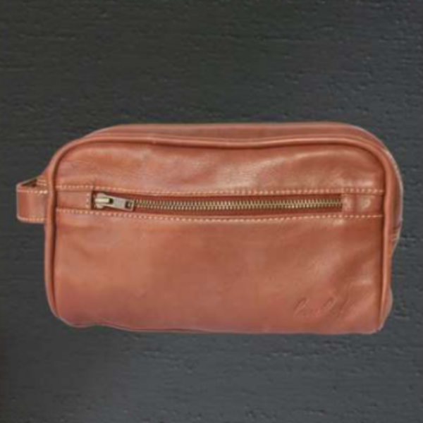 Close-up of the Luuks leather toiletry bag, highlighting the fine leather craftsmanship, sturdy zippers, and sophisticated texture.